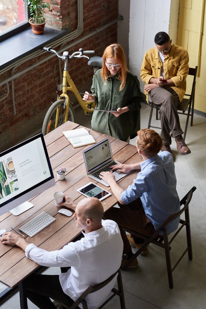 people-inside-a-room-3184359 Casual workspace with diverse team working and interacting in a modern office.